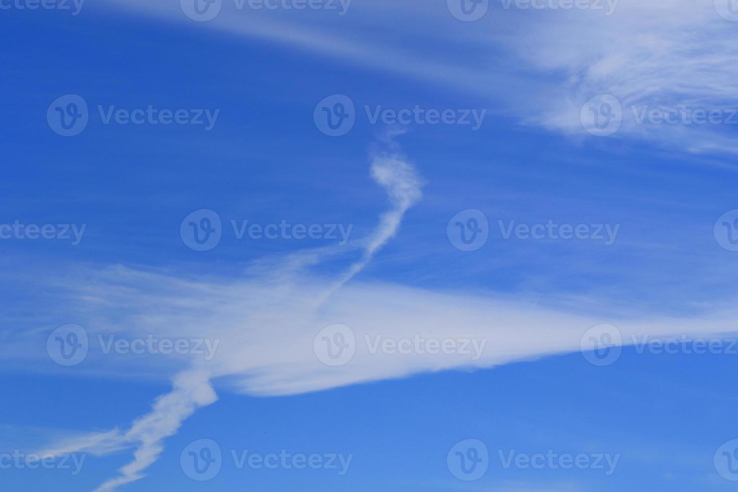 Clear blue sky and white clouds photo