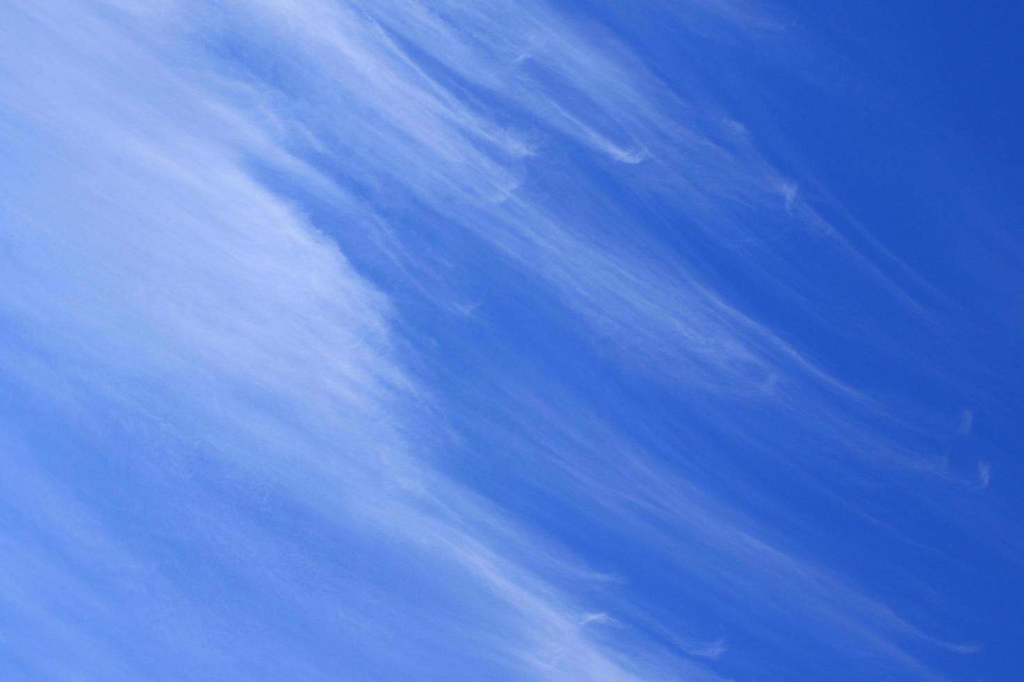 Clear blue sky and white clouds photo