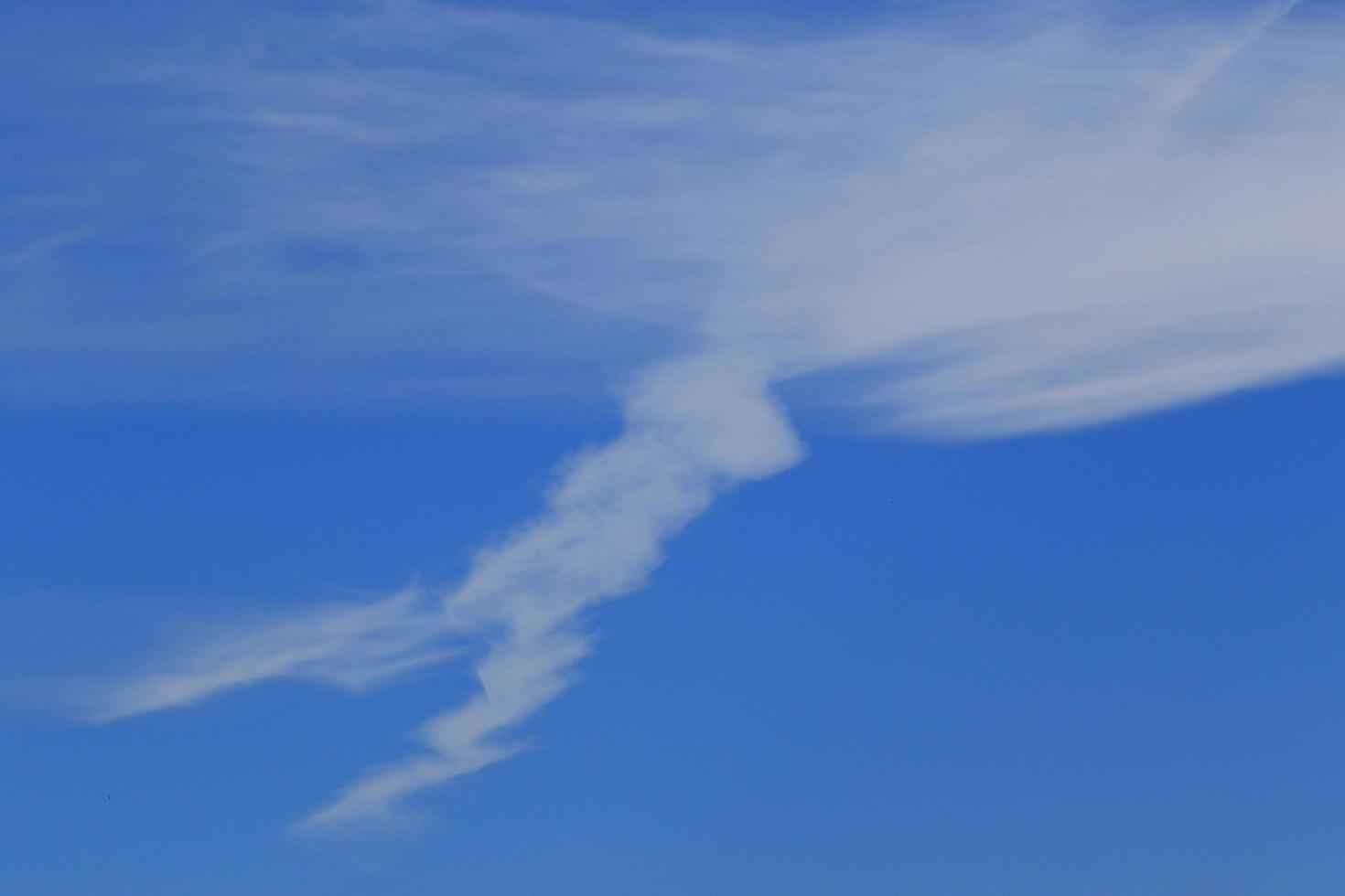 Clear blue sky and white clouds photo