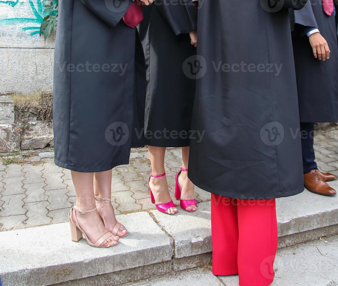 university graduating students are having a photo shooting in the park