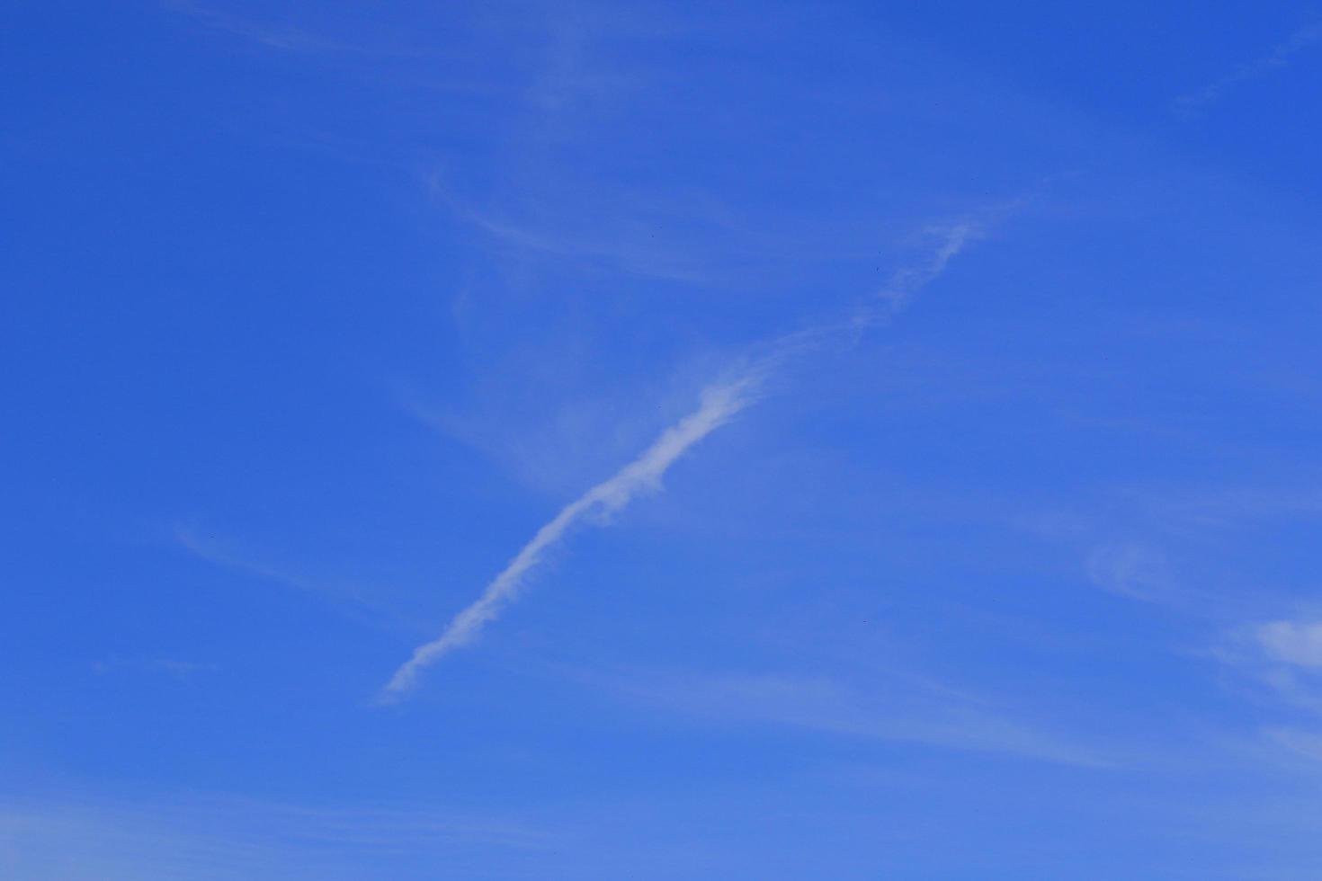 Clear blue sky and white clouds photo