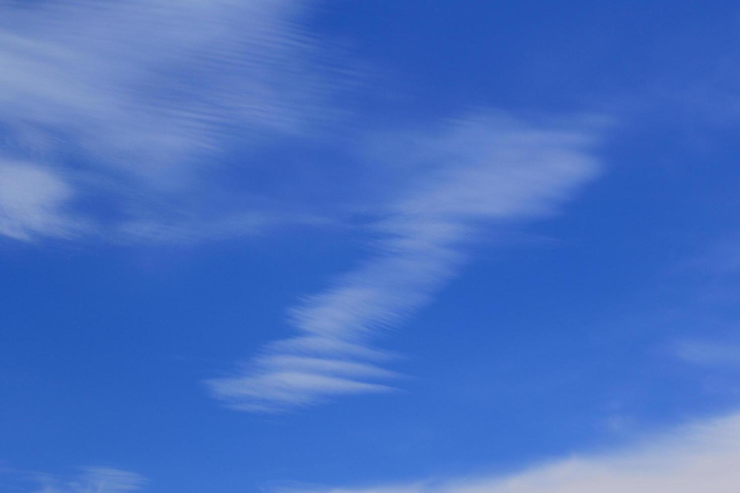 Clear blue sky and white clouds photo