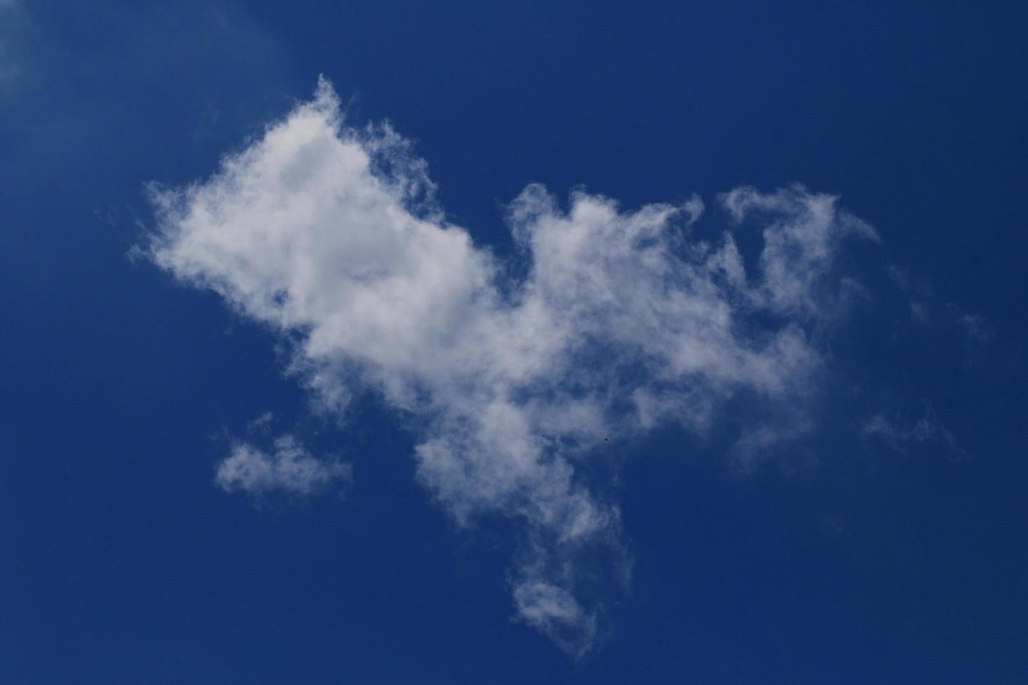 Clear blue sky and white clouds photo