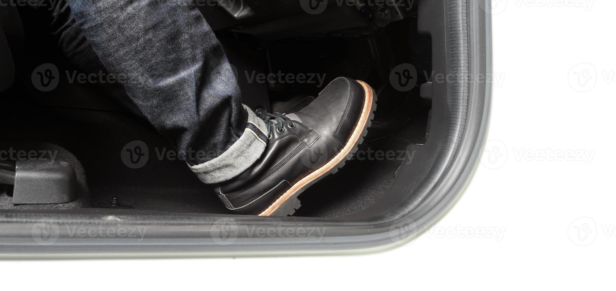 Close up foot press or push foot break and accelerate pedal of a car to drive ahead. photo