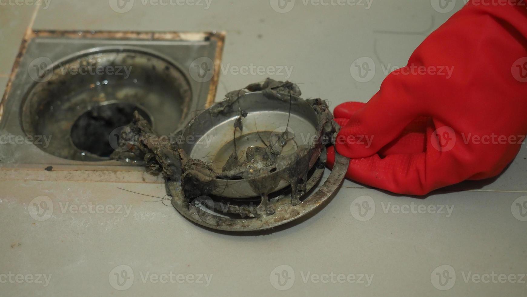 Drain cleaning Clogged and dirty sewer pipes floor drain. photo