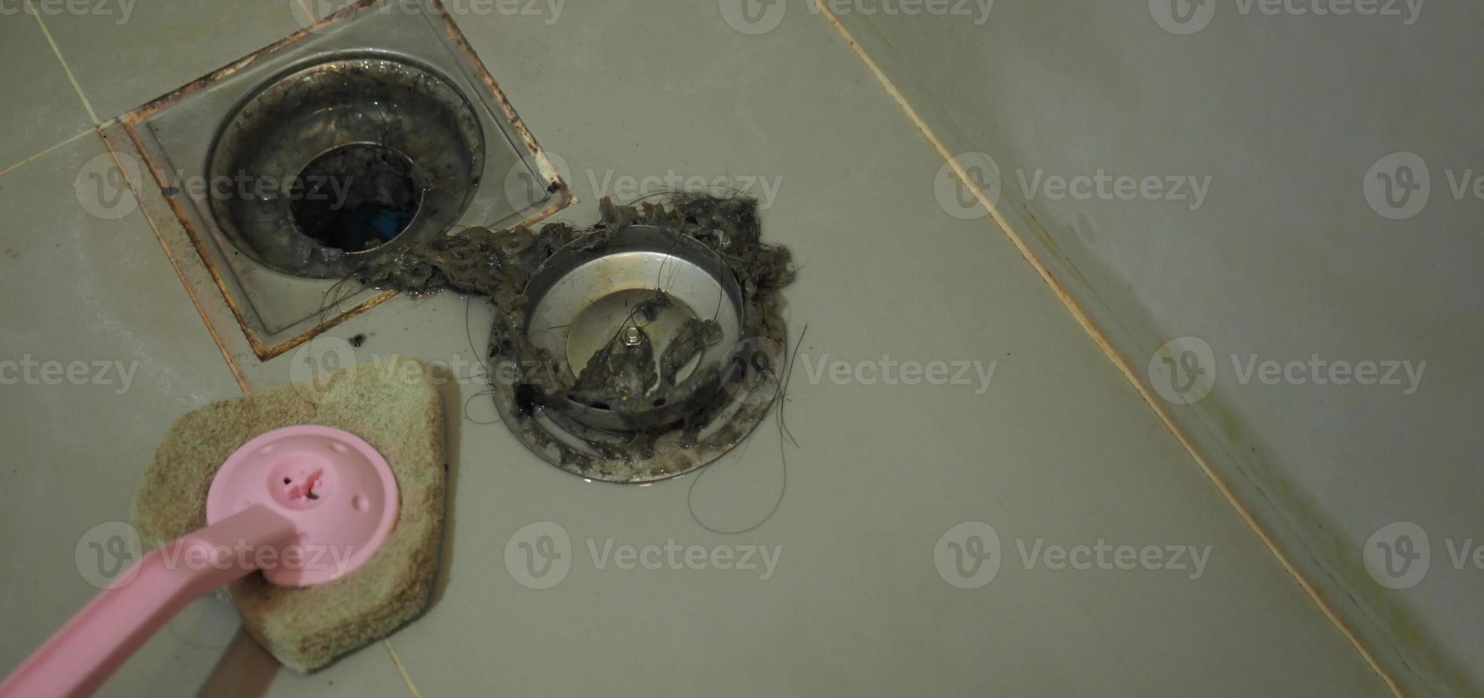 Drain cleaning Clogged and dirty sewer pipes floor drain. photo