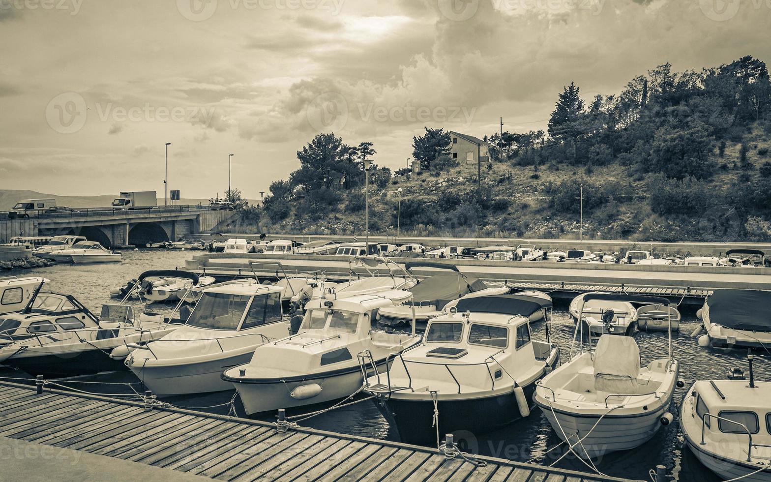 Beach at the marina beach boats promenade Novi Vinodolski Croatia. photo