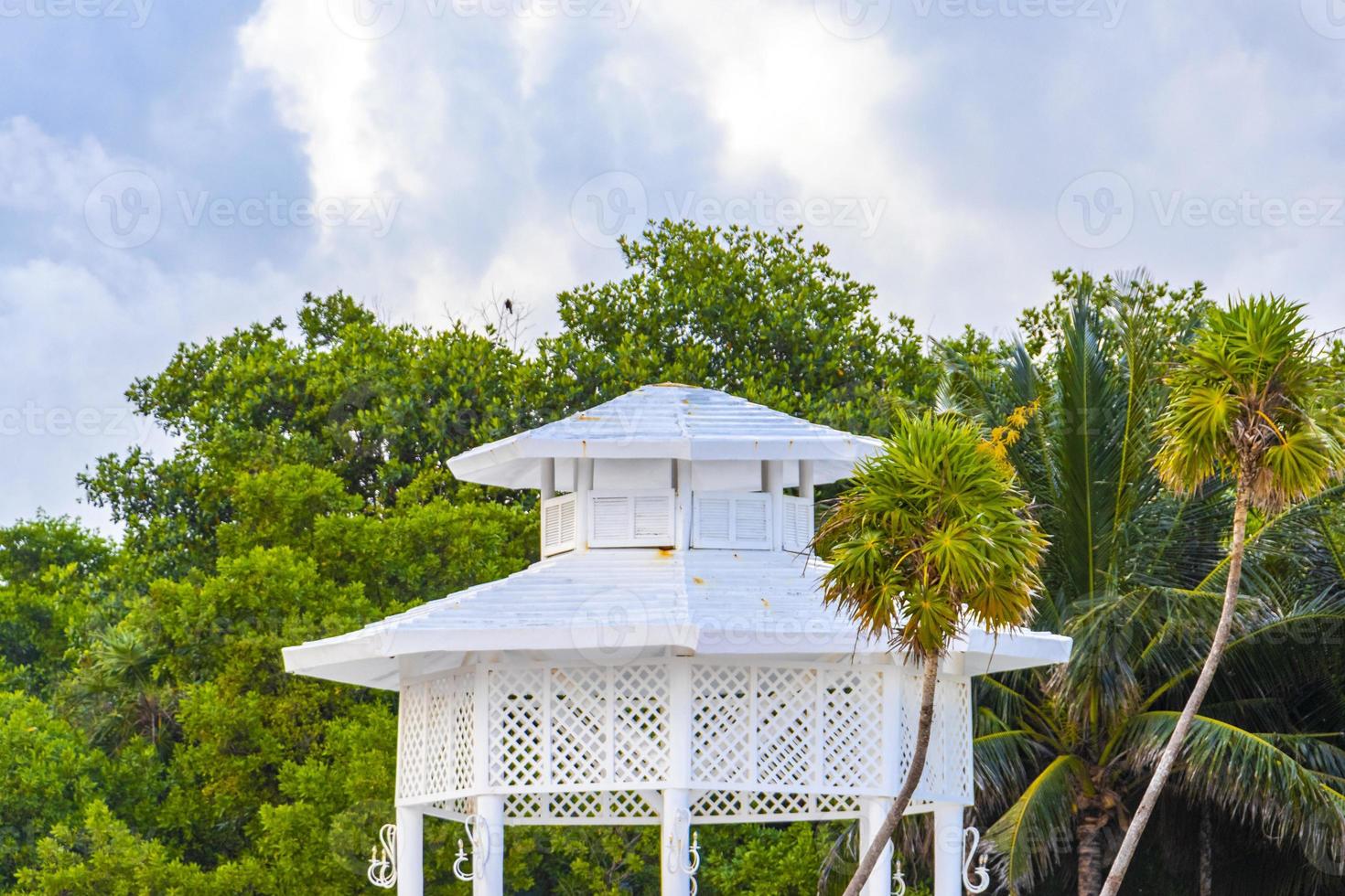 White noble pergula pavilion in paradise on beach palms Mexico. photo