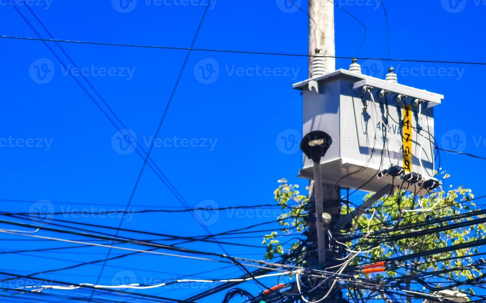 Absolute cable chaos on Thai power pole in Mexico. photo