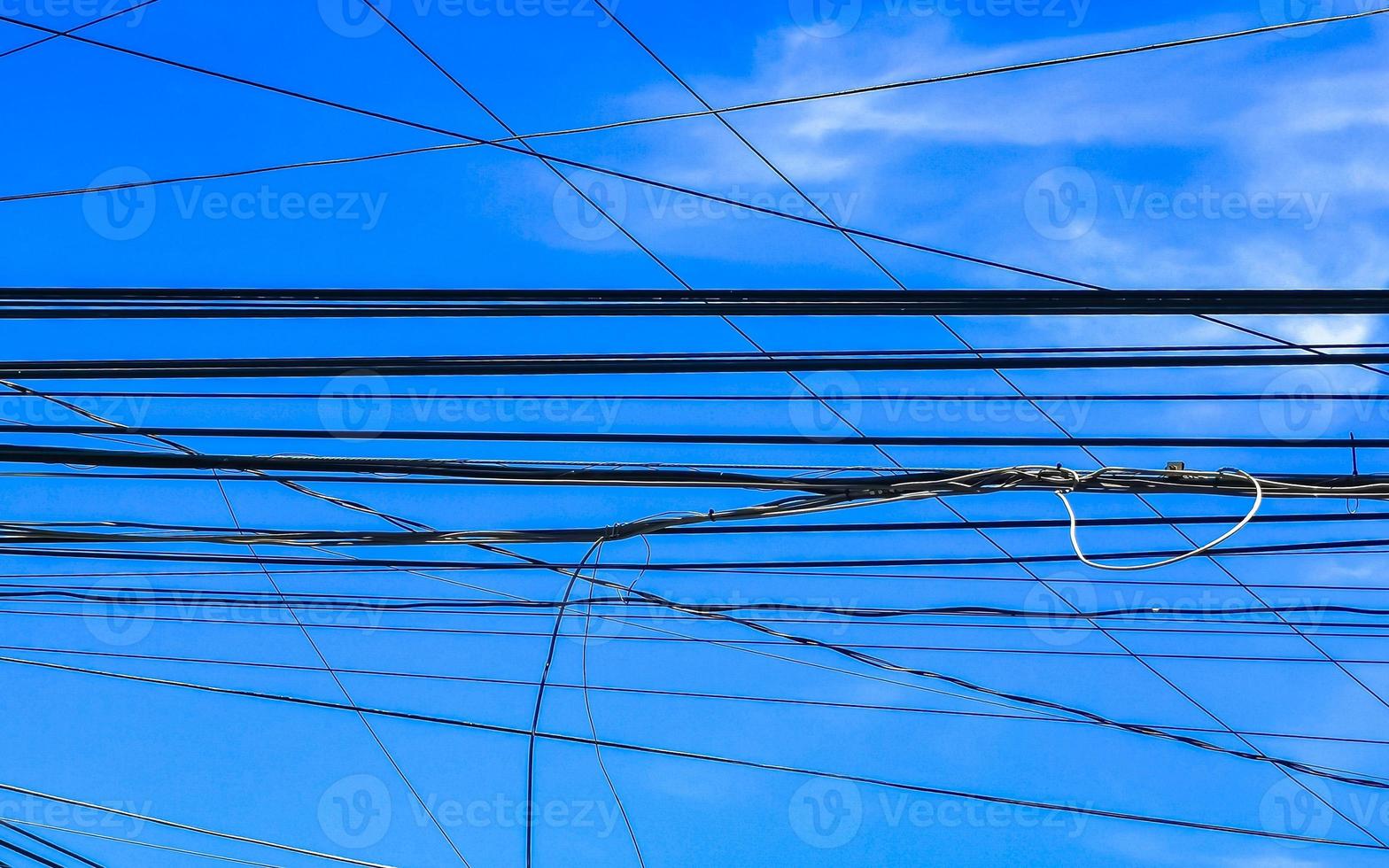 Absolute cable chaos on Thai power pole in Mexico. photo