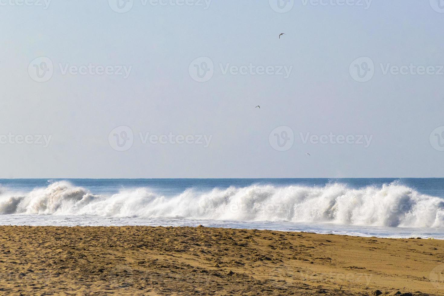 Extremely huge big surfer waves at beach Puerto Escondido Mexico. photo