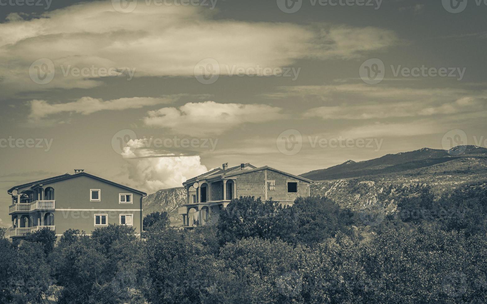 Houses in the nature mountain landscape of Novi Vinodolski Croatia photo