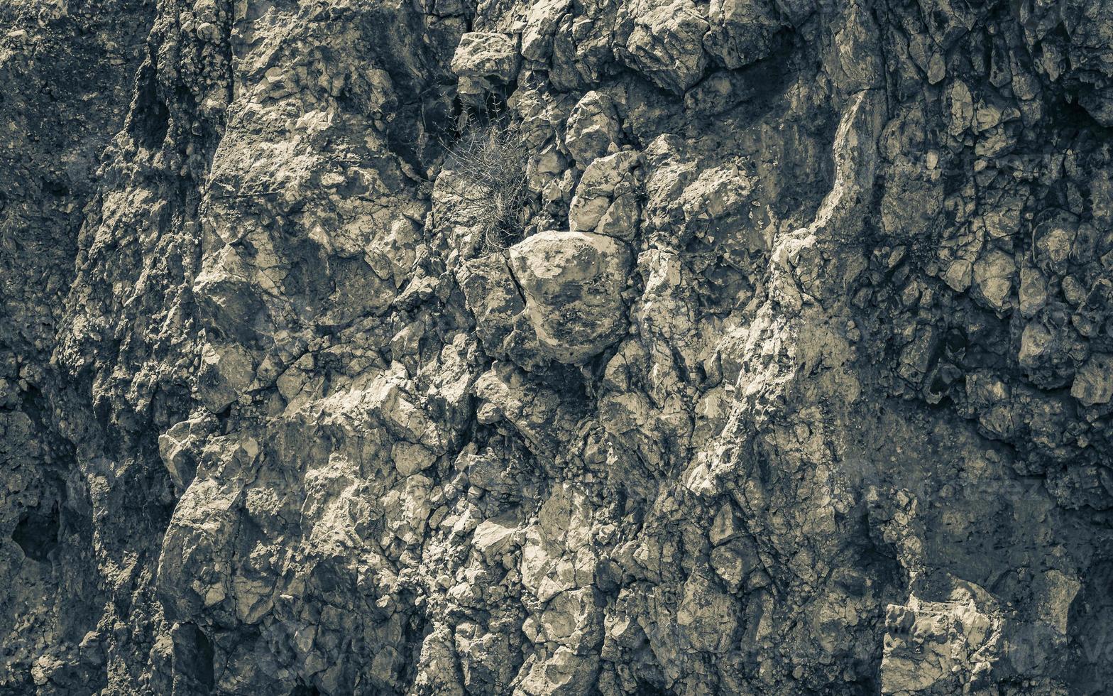 Texture of rough rocks on the coast of Croatia. photo