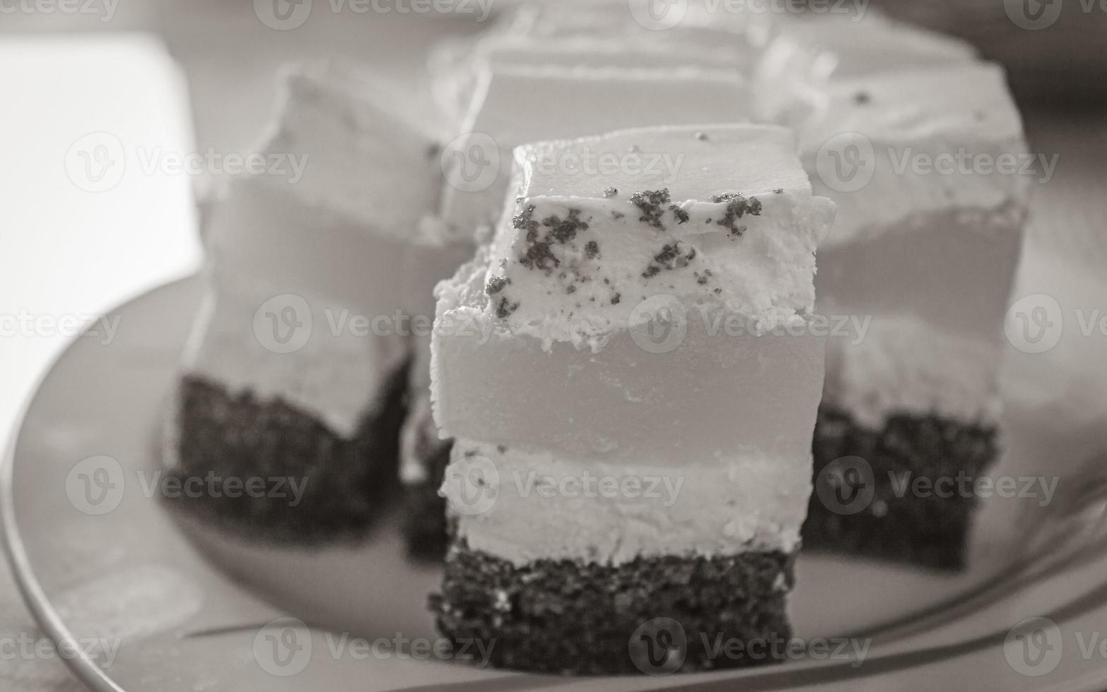 Cream tangerine mandarins orange cake on white plate in Croatia. photo