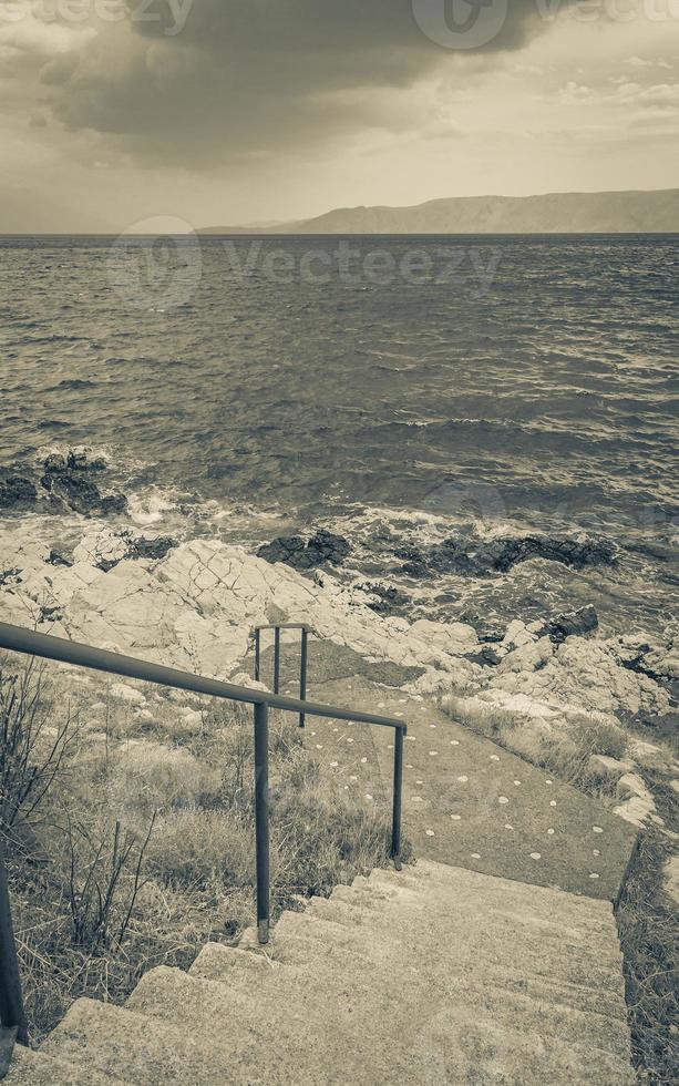 Stairs to the paradise turquoise beach Novi Vinodolski Croatia. photo