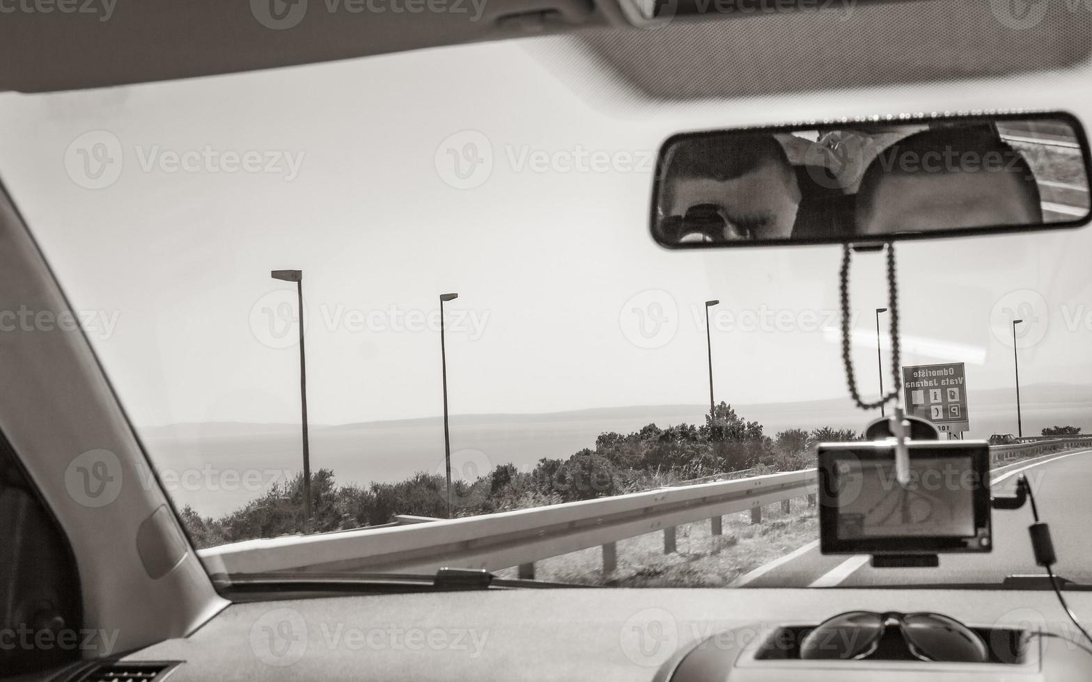 Driving on highway of Croatia interior view of the car. photo