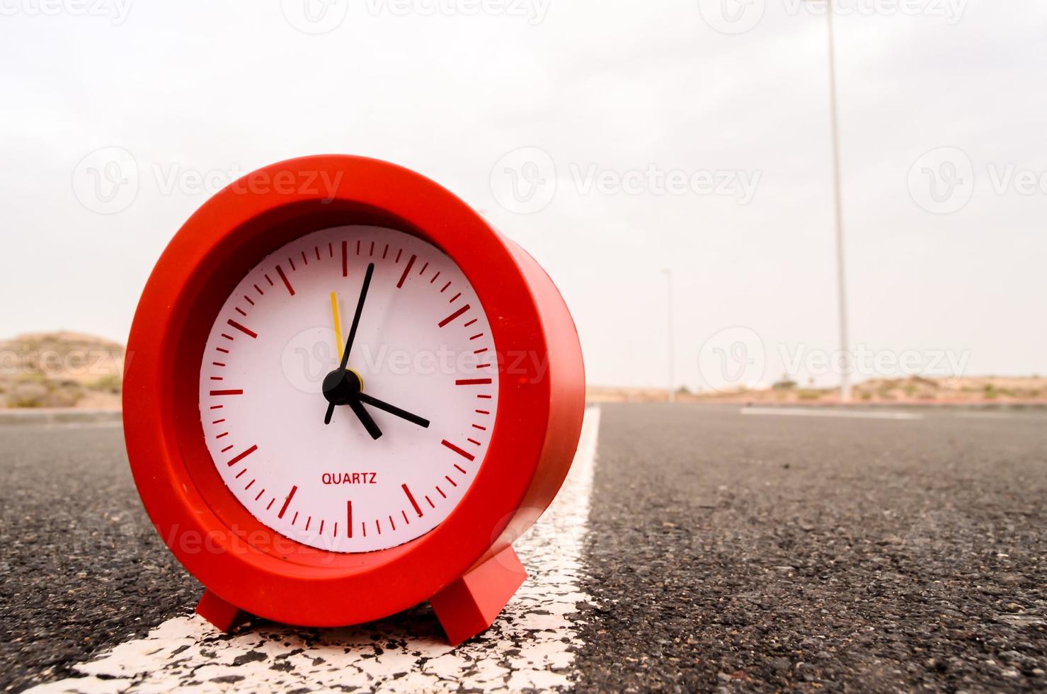 Clock on the road photo