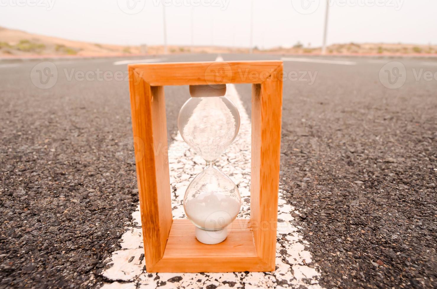 Hourglass on the road photo