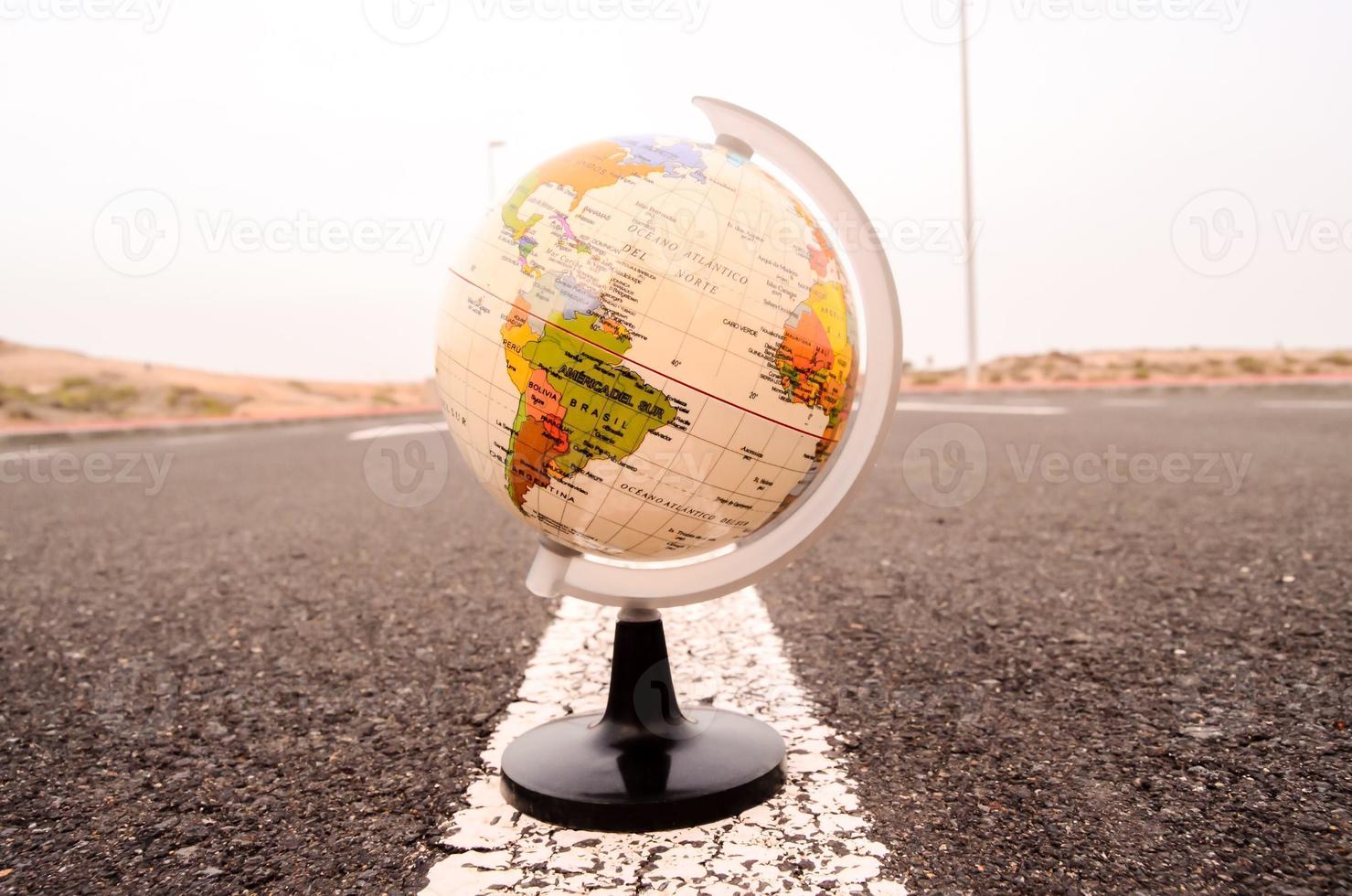 Globe on the road photo