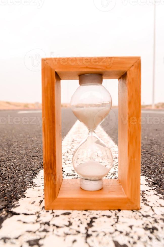 Hourglass on the road photo