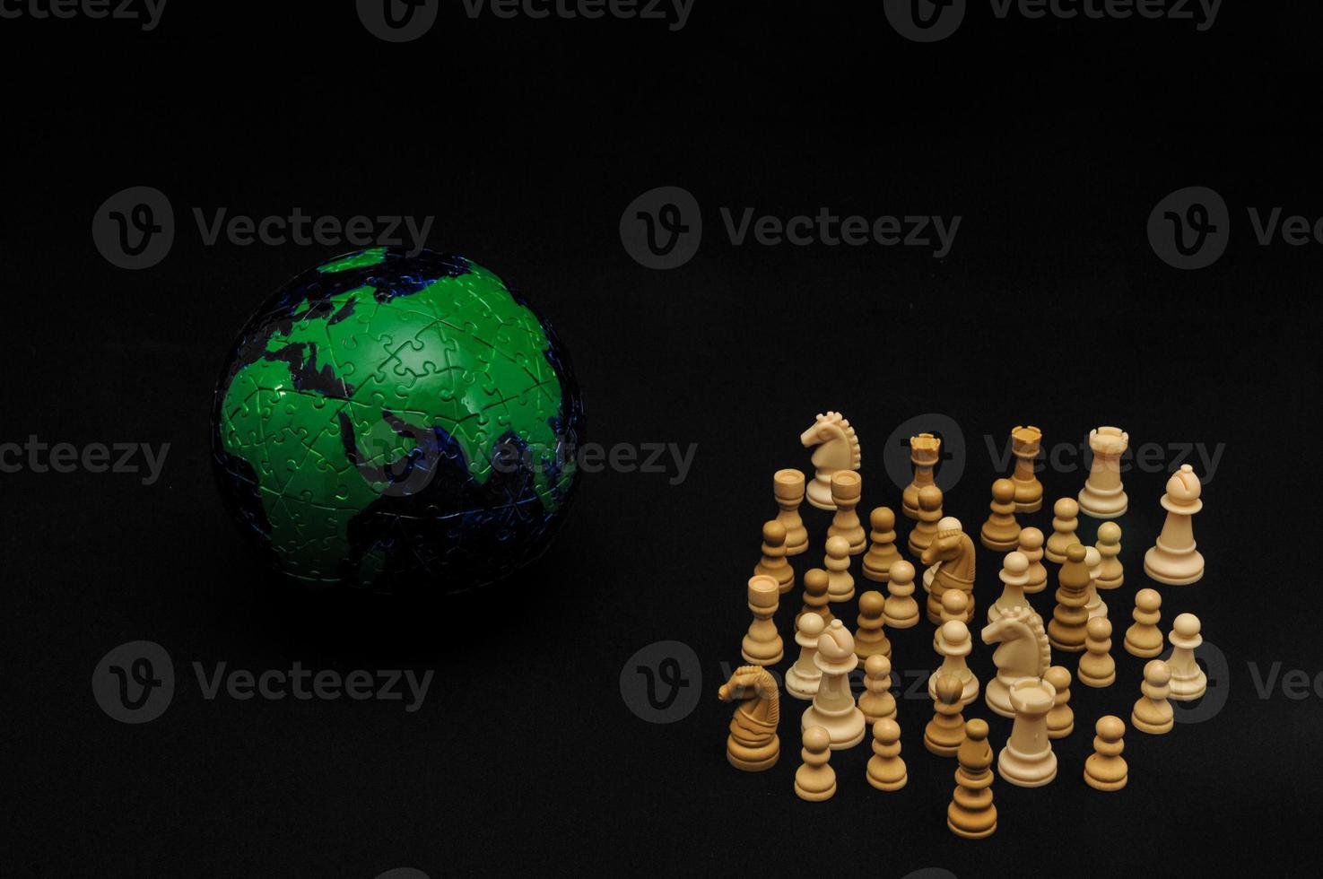 Chess figures on black background photo