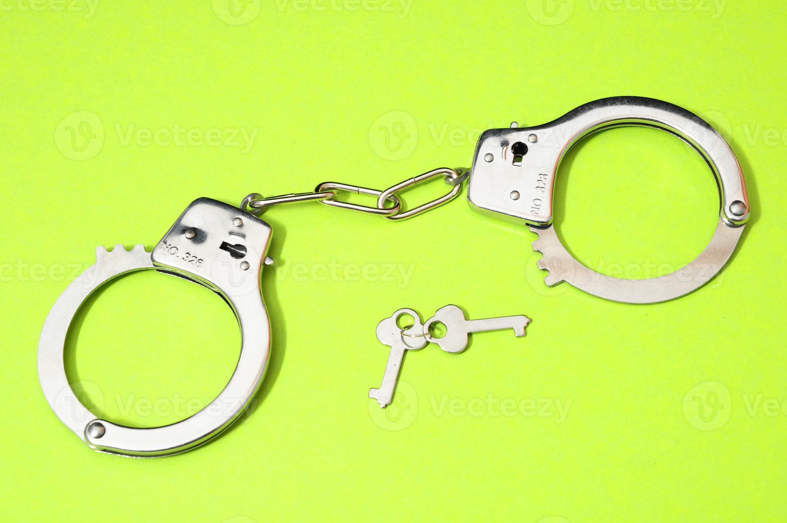 Handcuff and keys 18854889 Stock Photo at Vecteezy