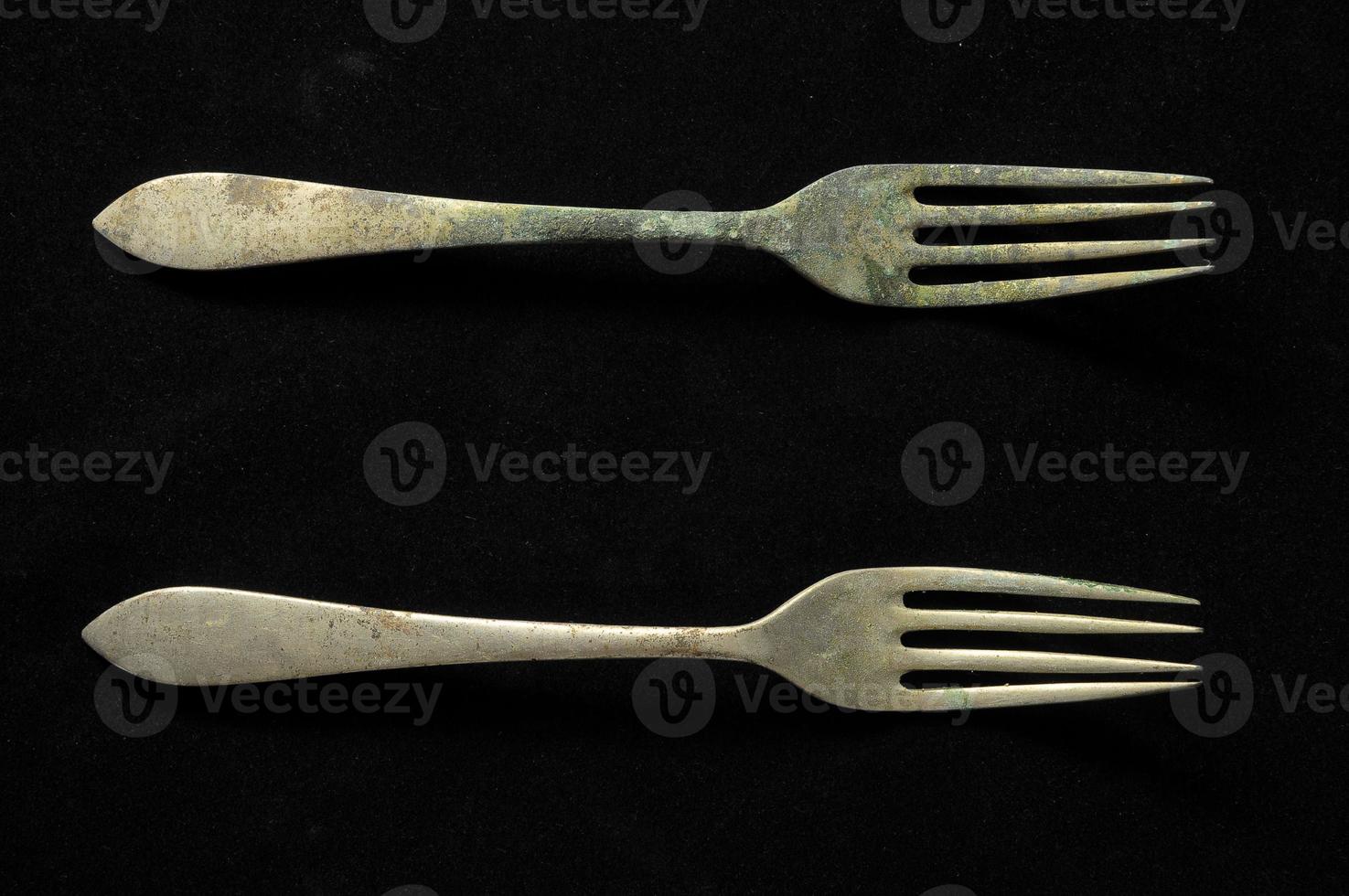 Forks on black background photo