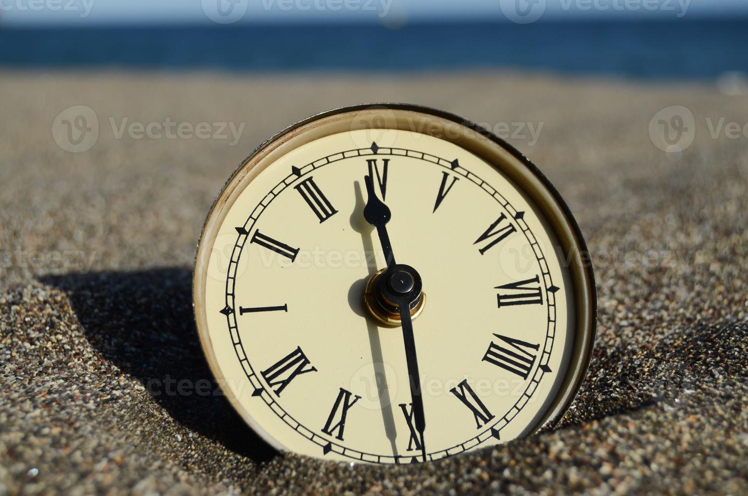 Watch in the sand photo