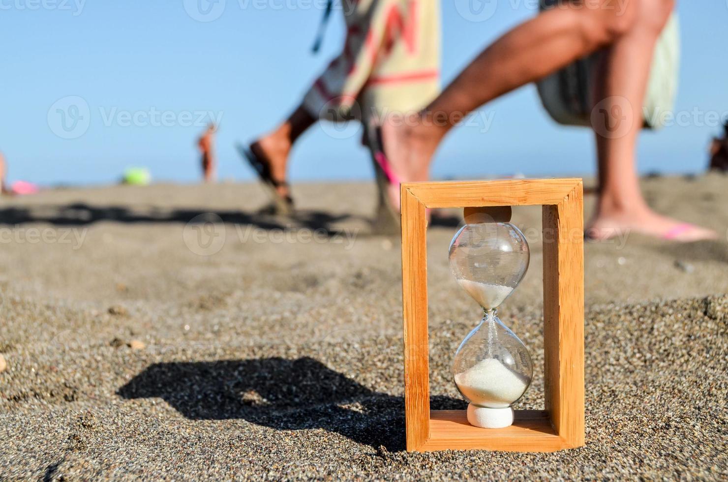 Hourglass on the ground photo