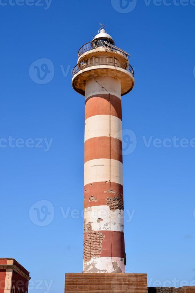 Lighthouse by the sea photo