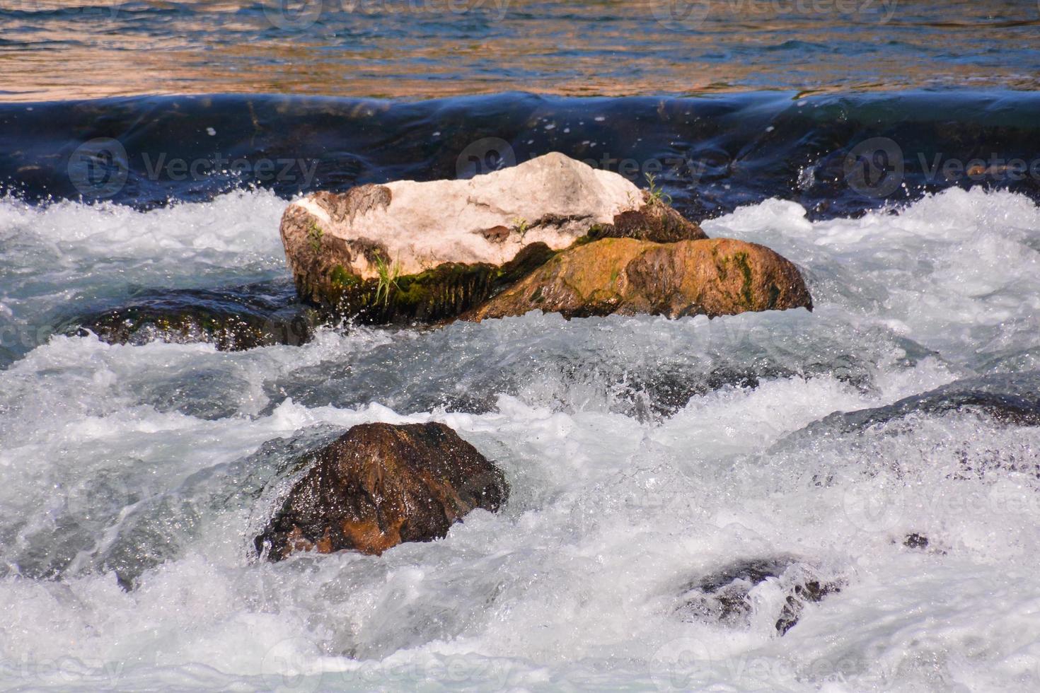 Waves at the rocky shore photo