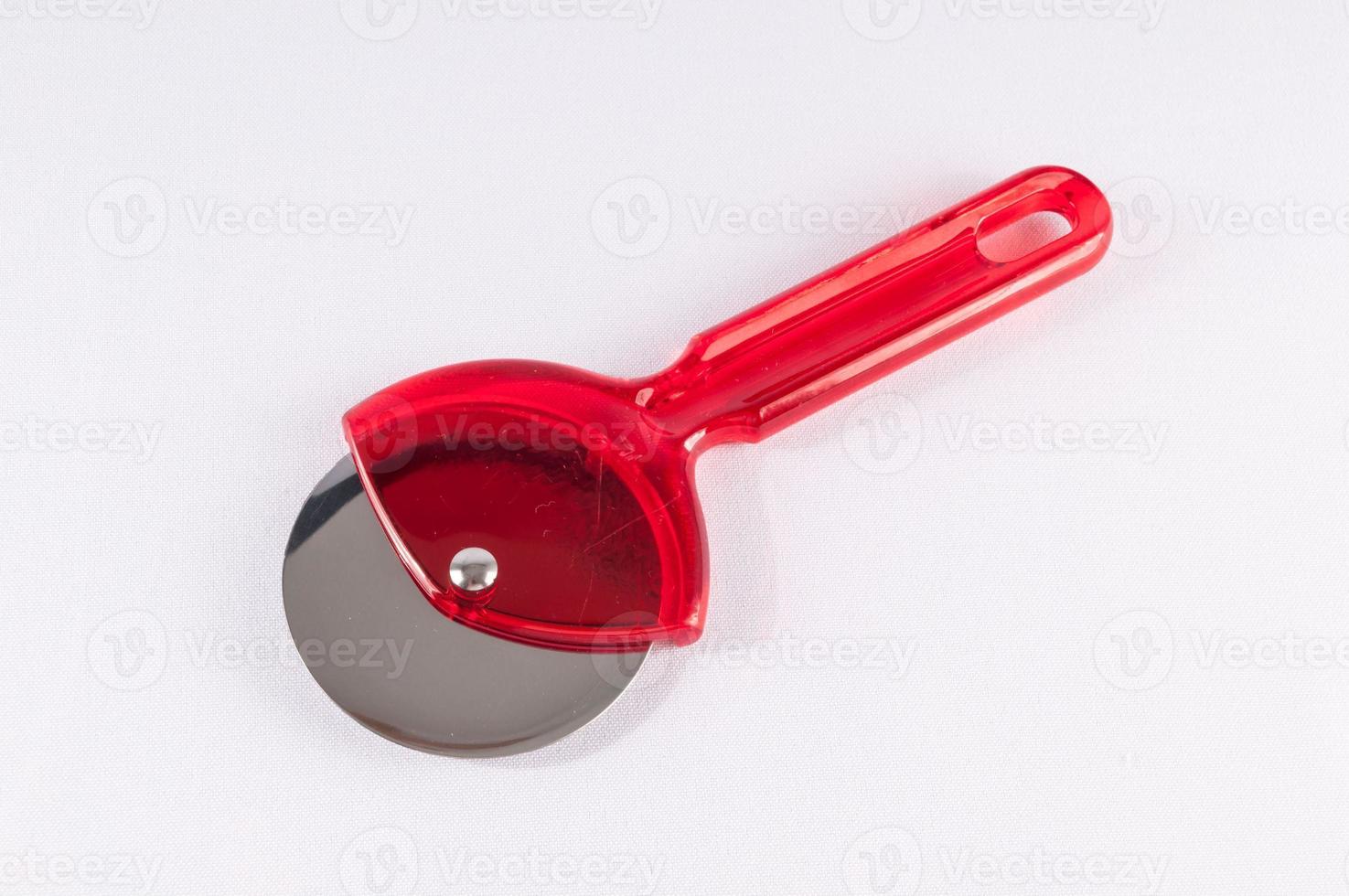 Pizza cutter on white background photo
