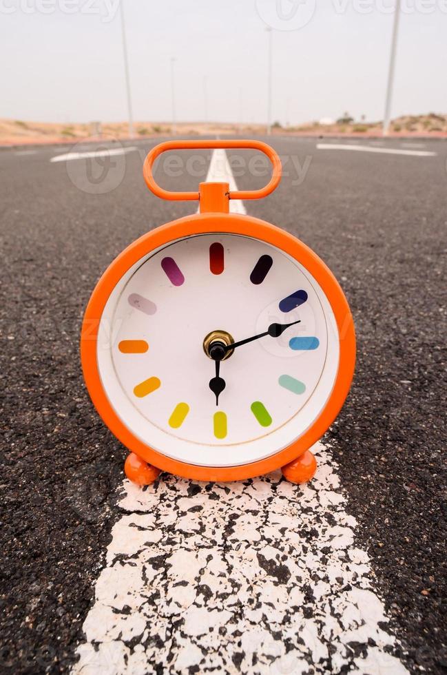 Clock on the road photo