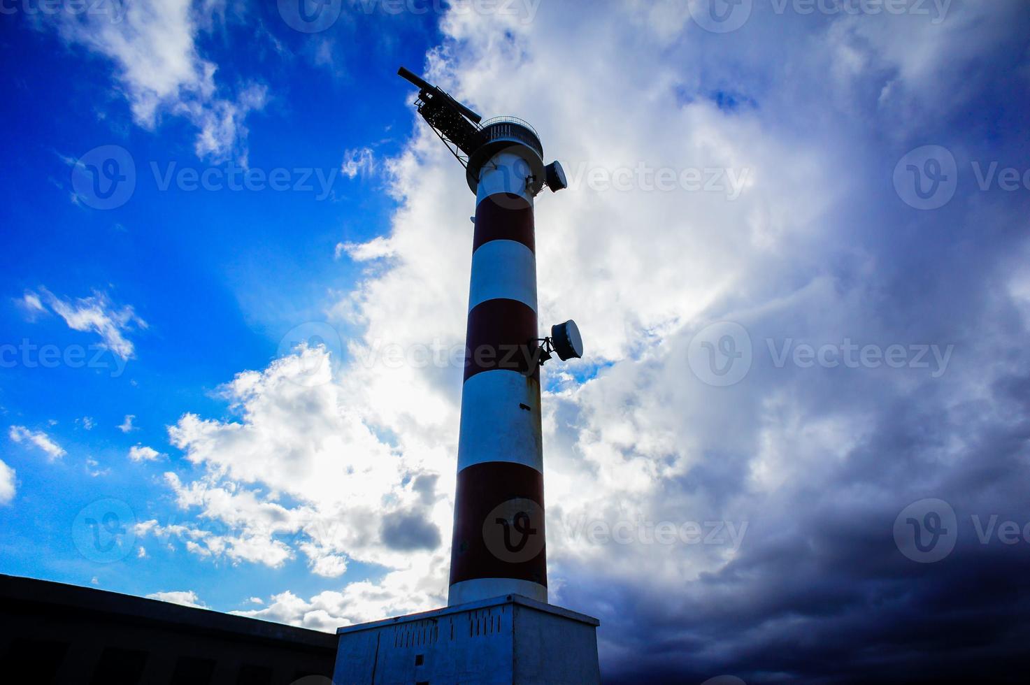 Lighthouse by the sea photo
