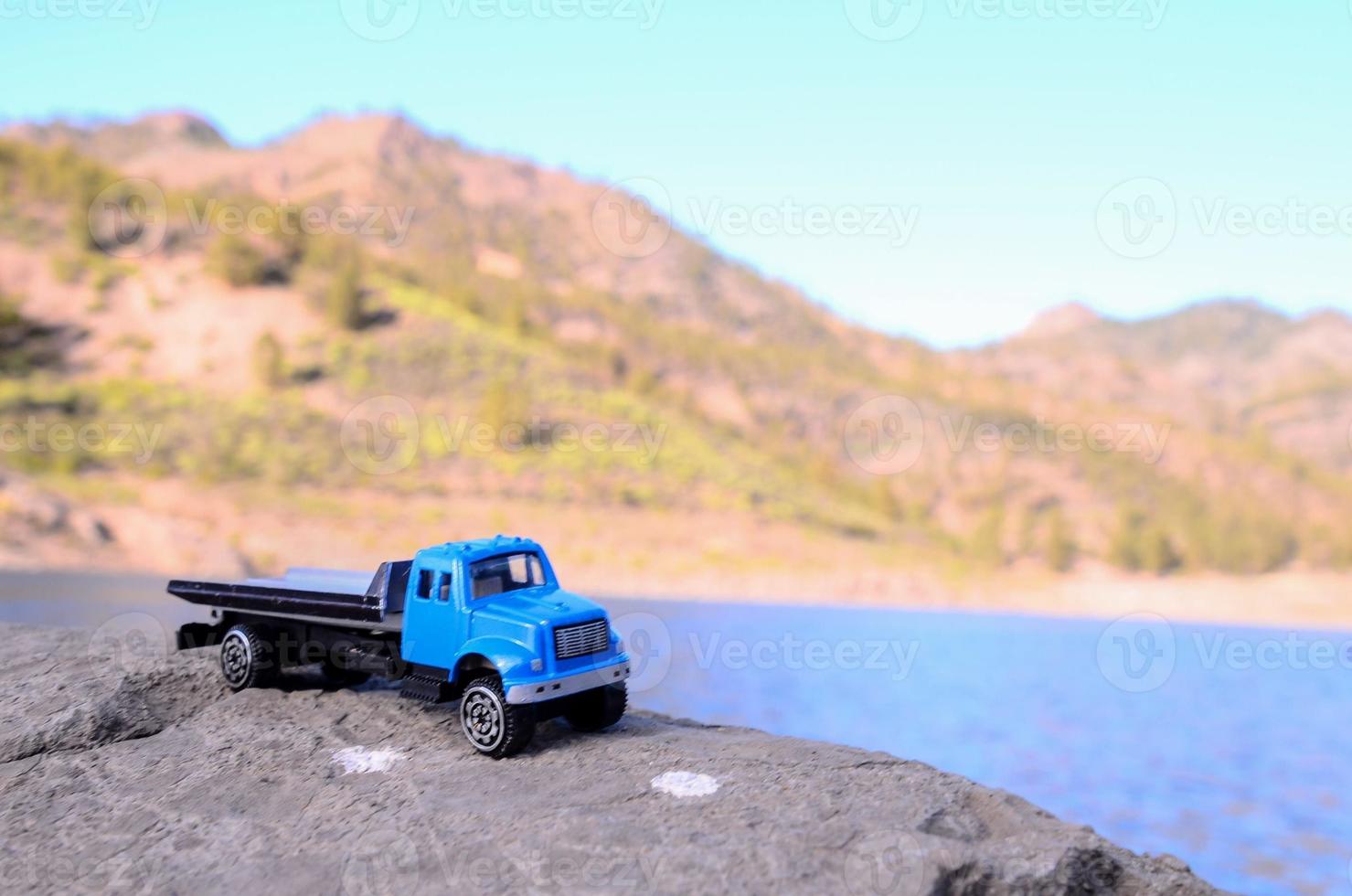 Toy truck on a rock photo