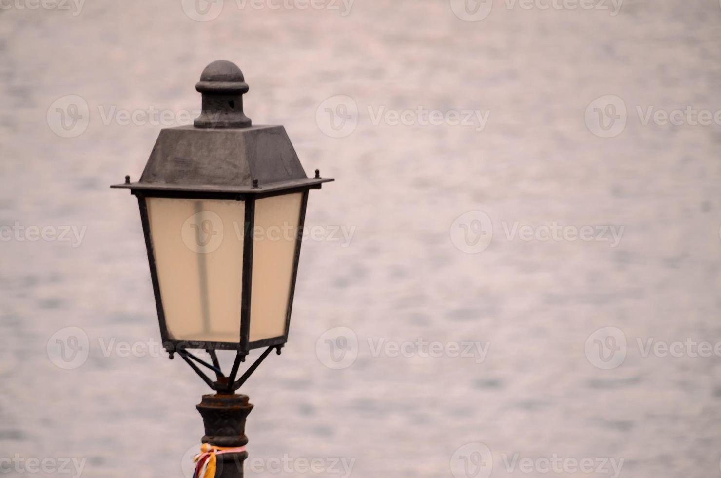 Street lamp by the sea photo