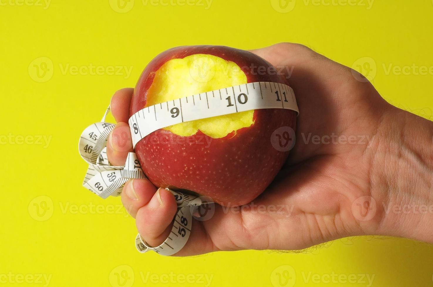 Apple and measuring tape photo