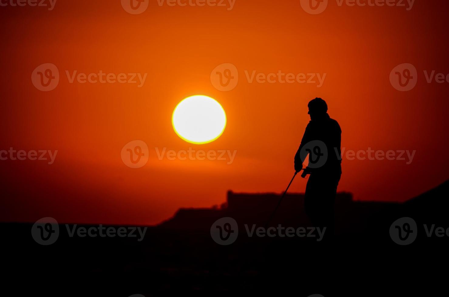 Silhouette at sunset photo