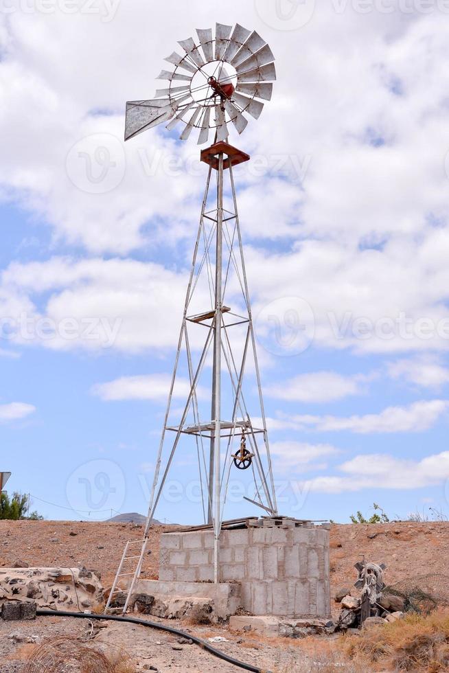 Traditional windmill under clear blue sky photo