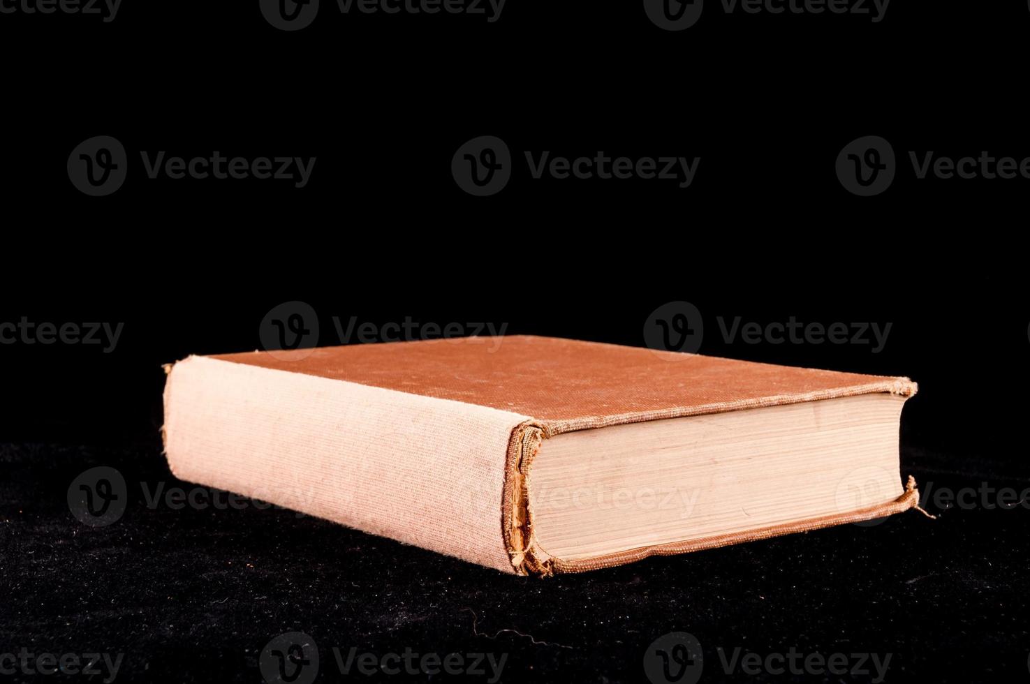 Book on black background photo