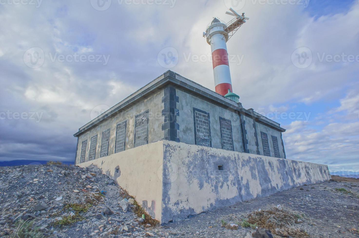 Lighthouse by the sea photo