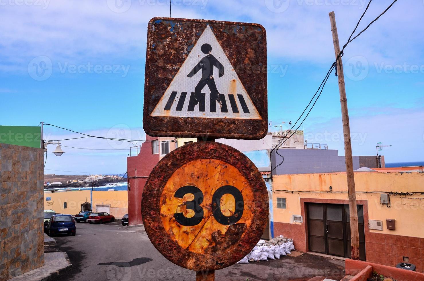 Corroded traffic signs on the street photo