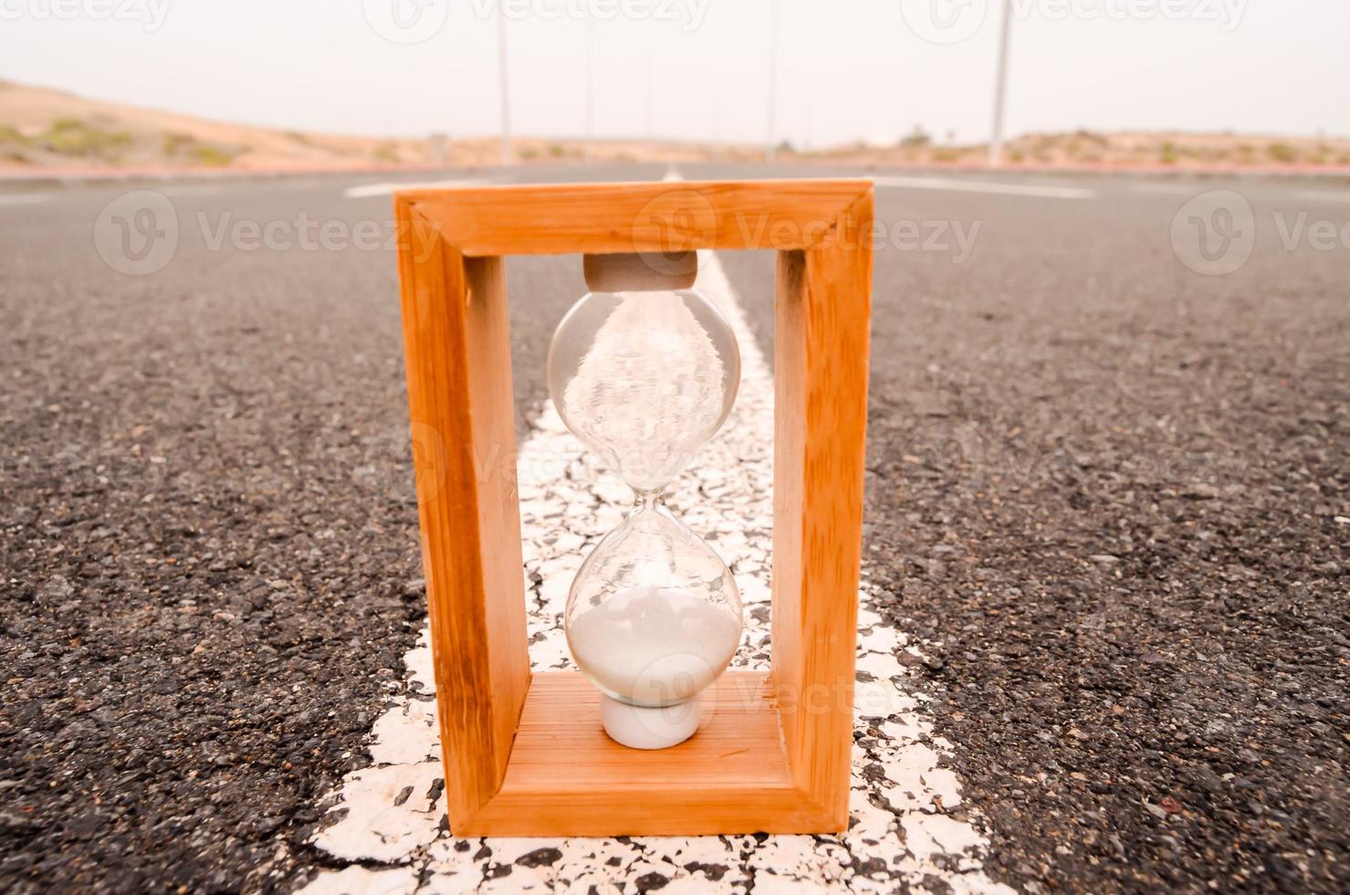 Hourglass on the road photo