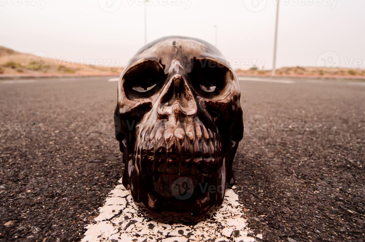 Black skull on the road photo
