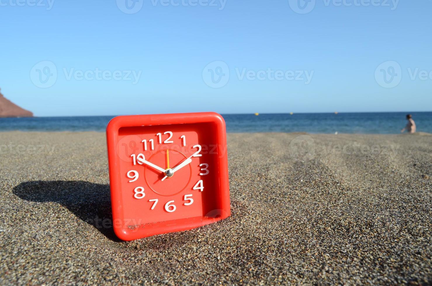 Clock on the beach photo