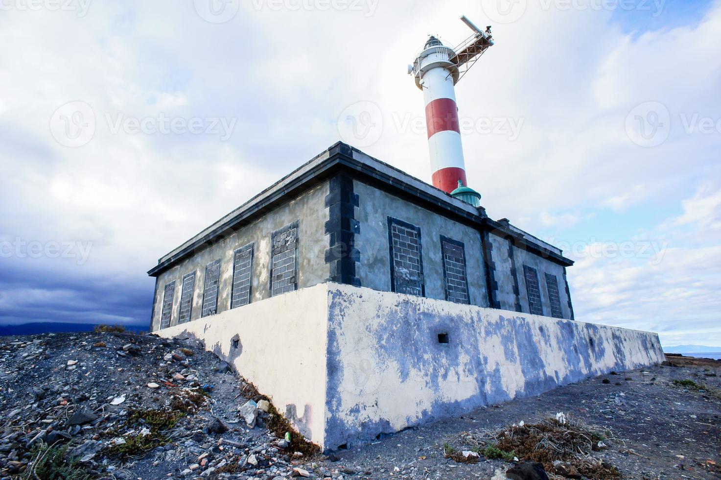 Lighthouse by the sea photo