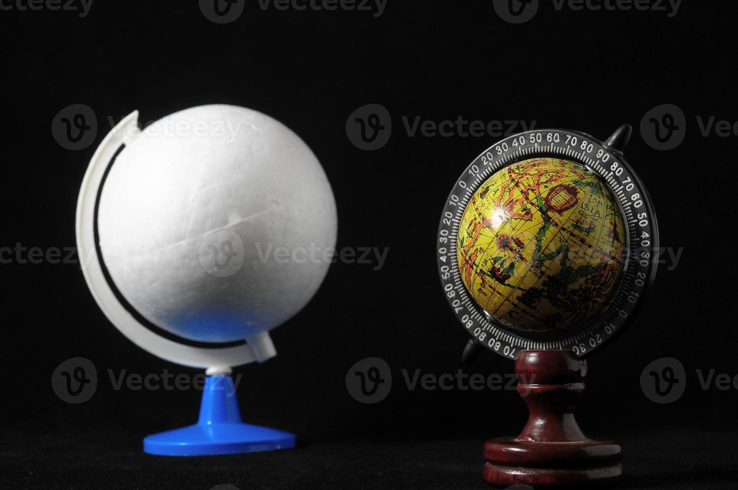 Globes on black background photo