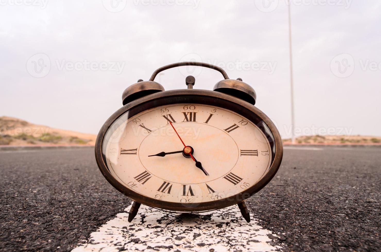 Clock on the road photo