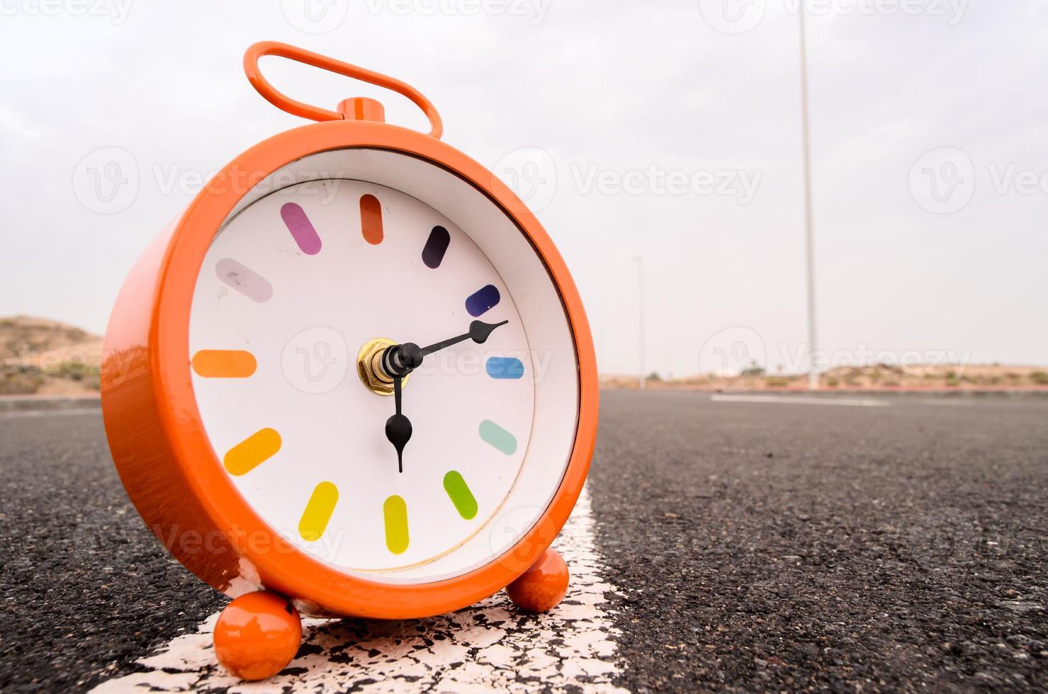 Clock on the road photo