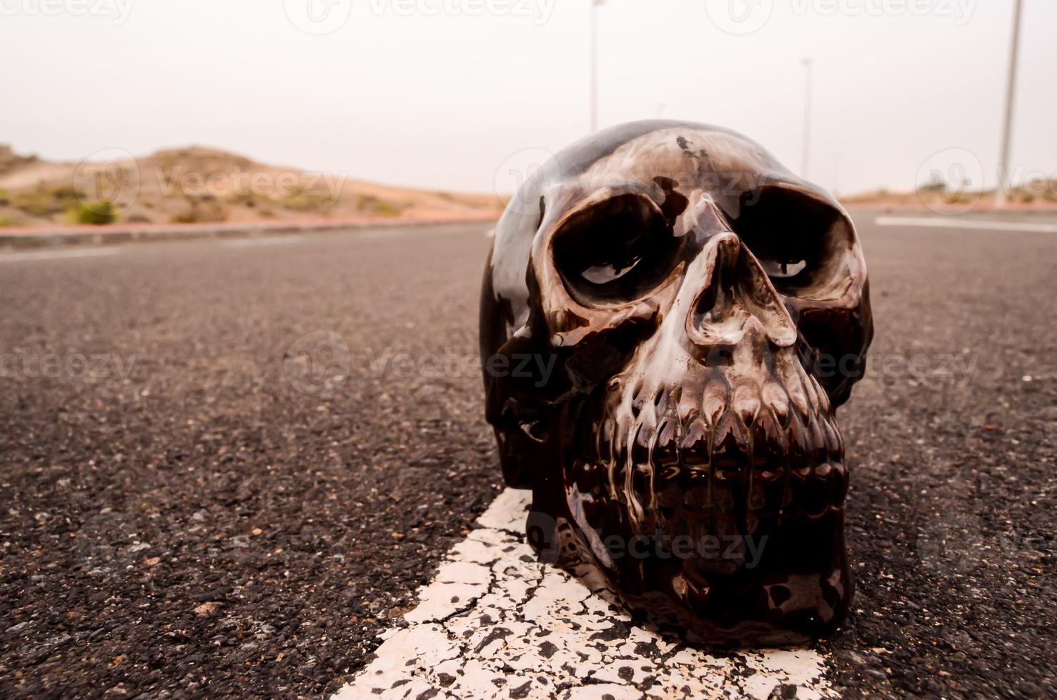 Black skull on the road photo